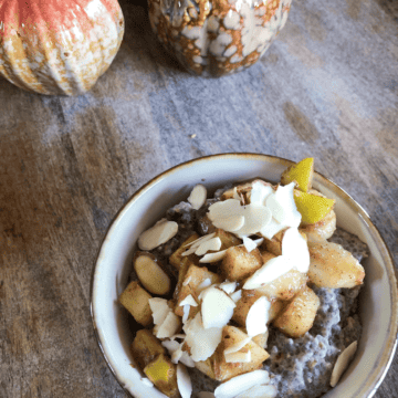 Cinnamon chia seed pudding in a bowl with apples and bananas