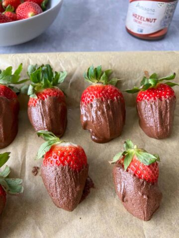 Easy chocolate covered strawberries on parchment paper