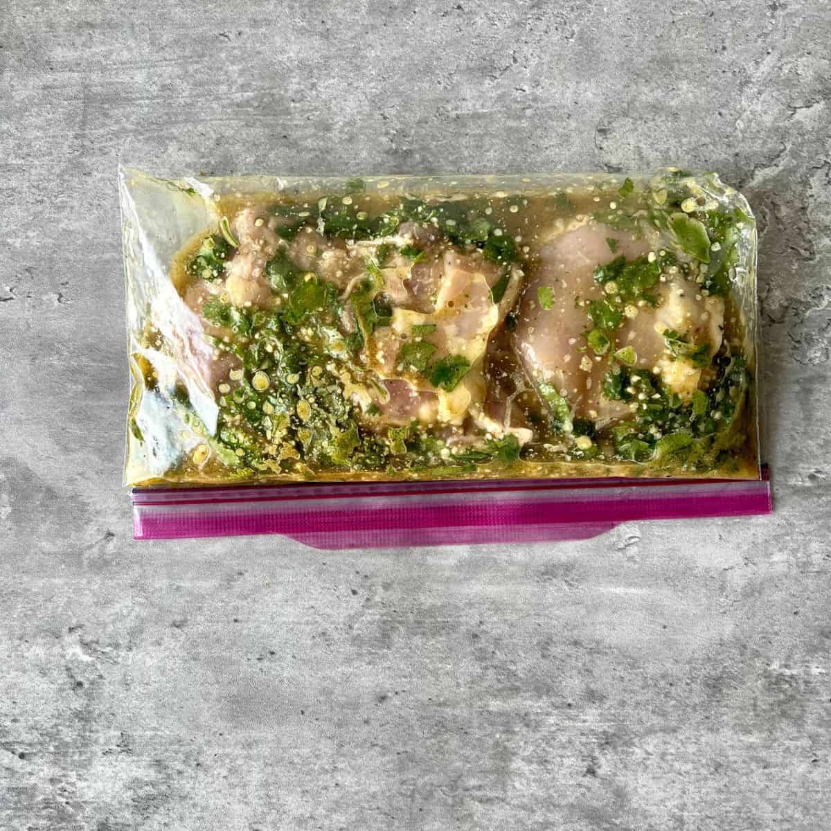 paleo cilantro lime chicken marinating in a bag