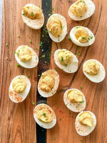 dairy free deviled eggs on a wood board