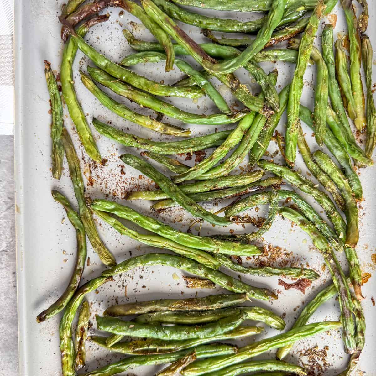 Oven roasted green beans on a pan